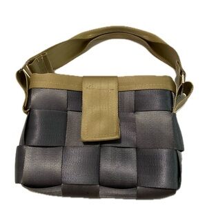 Handmade, small, seatbelt bag. Gray and tan in color. Gold damask lining.